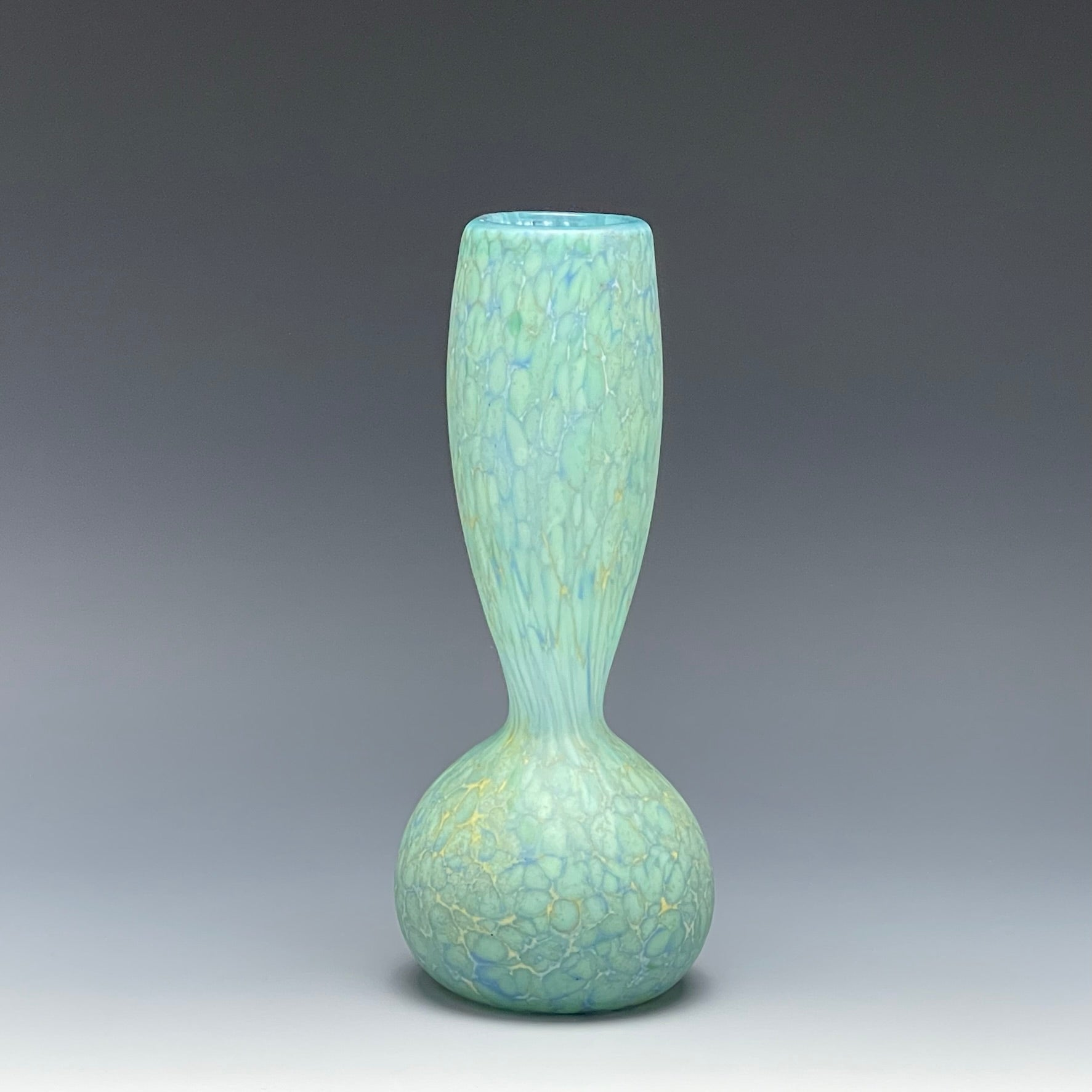 celadon blown glass bottle