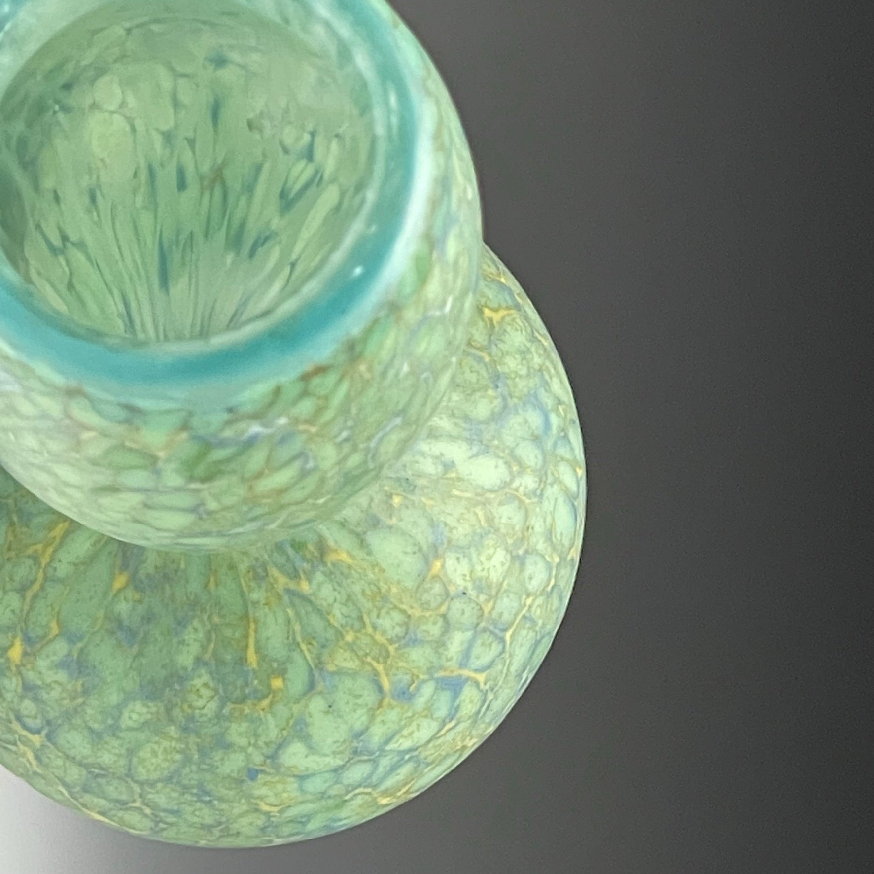 top view of celadon blown glass bottle