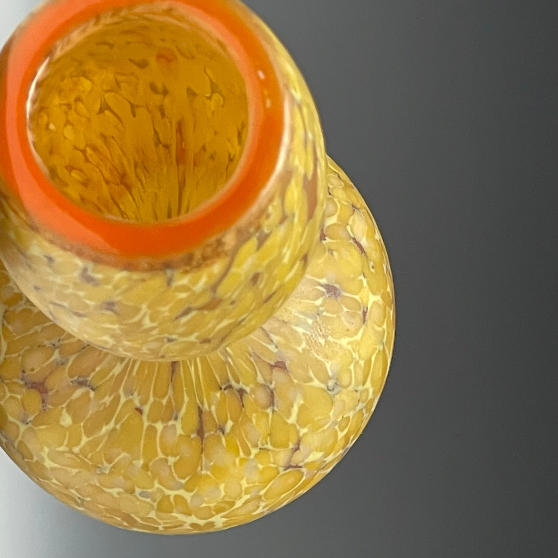 top view of curry blown glass bottle