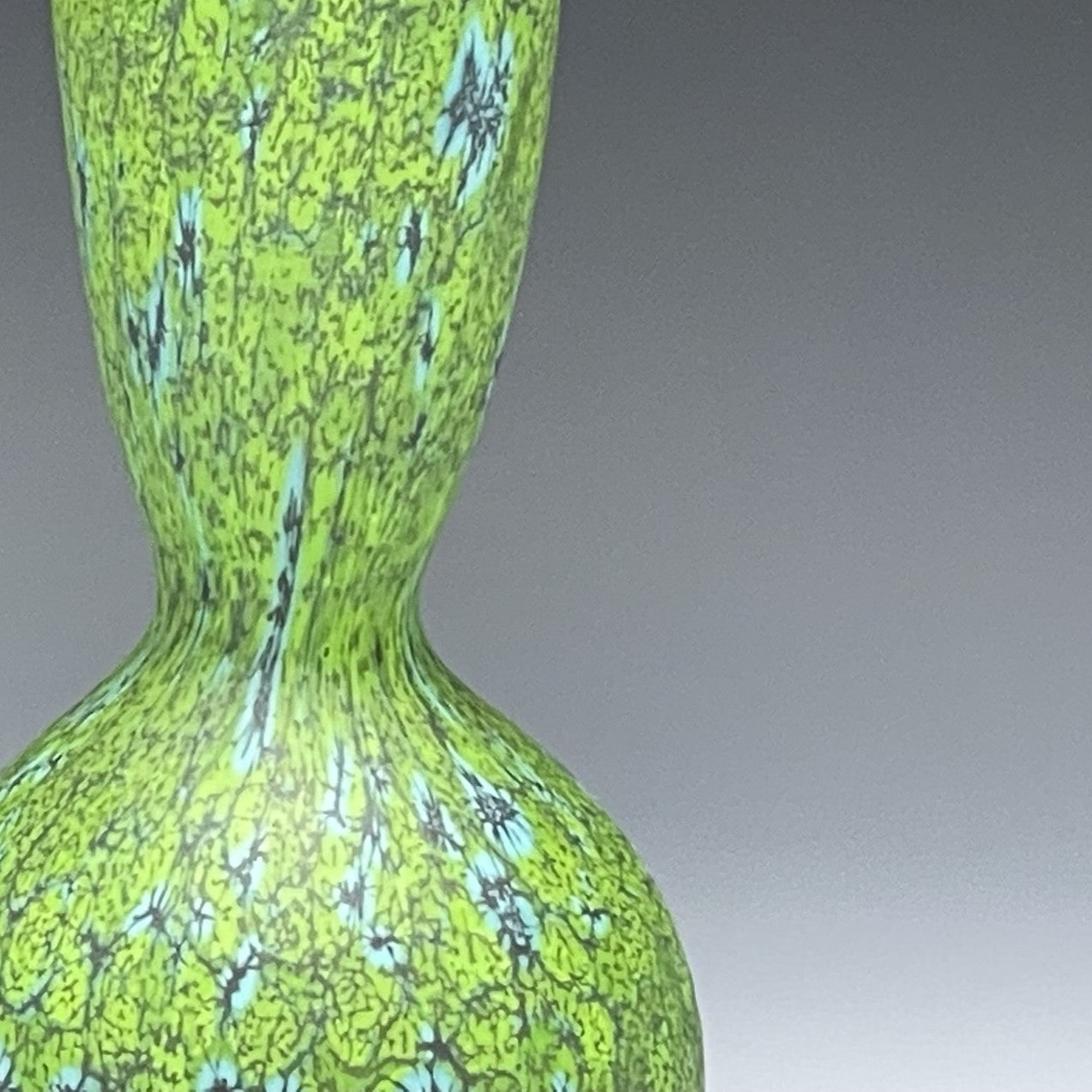 detail of green blown glass bottle