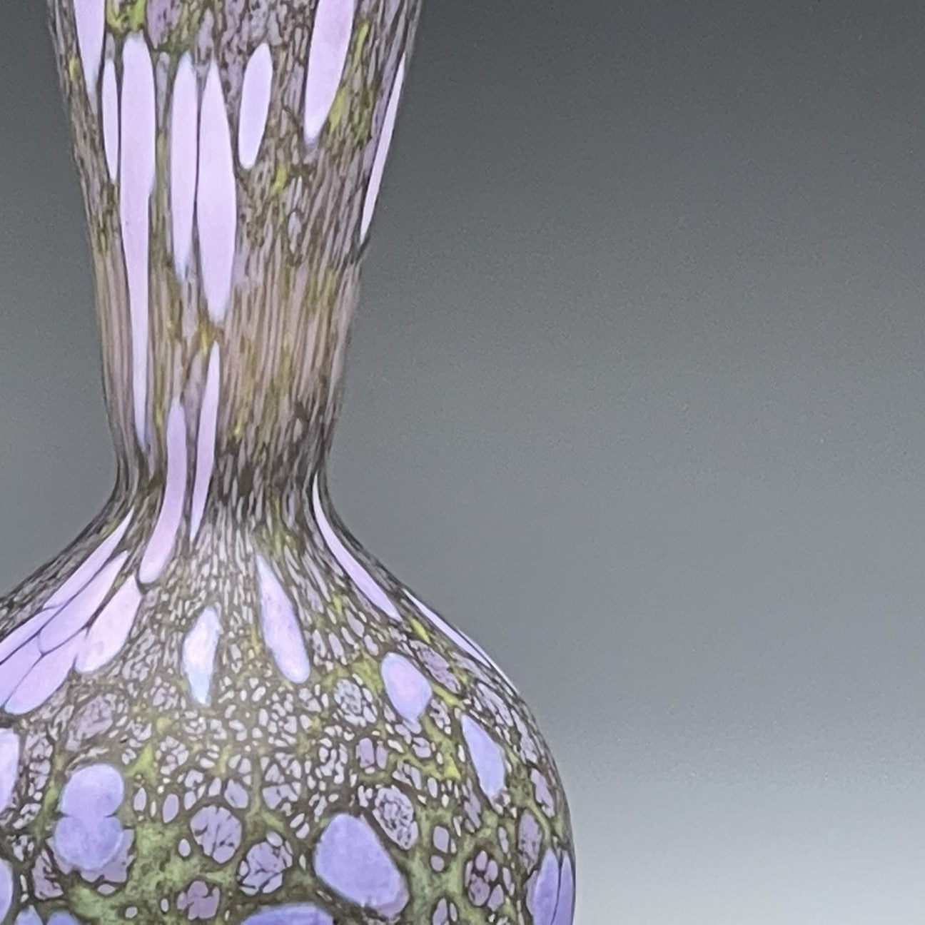 detail of purple blown glass bottle