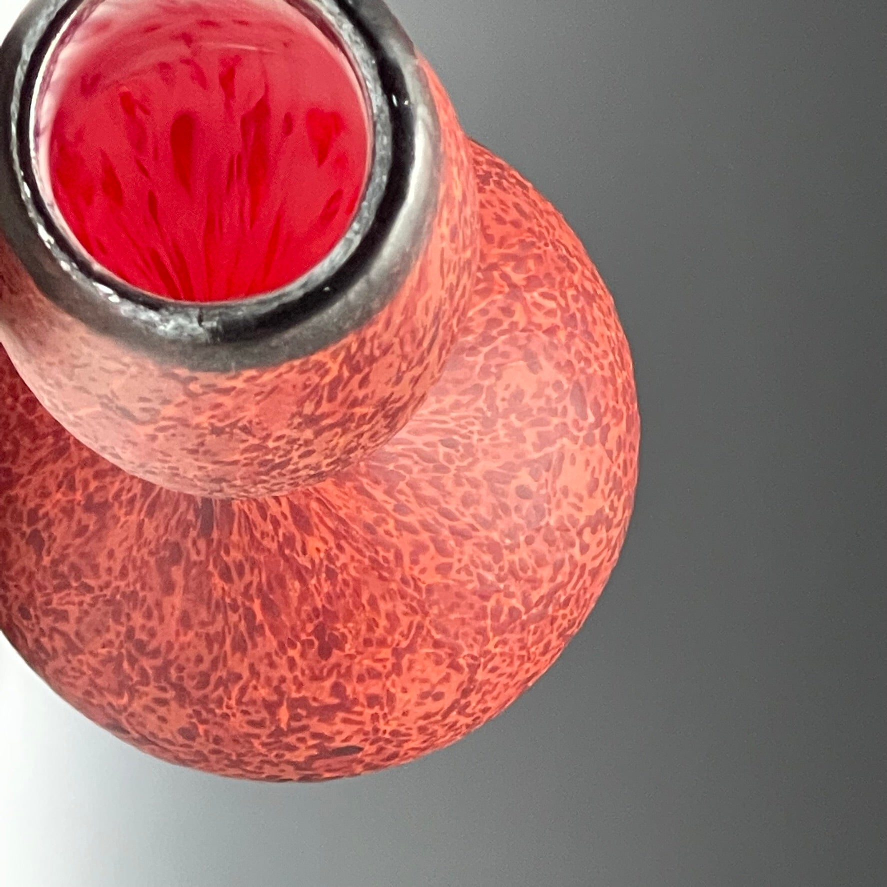 top view of red blown glass bottle