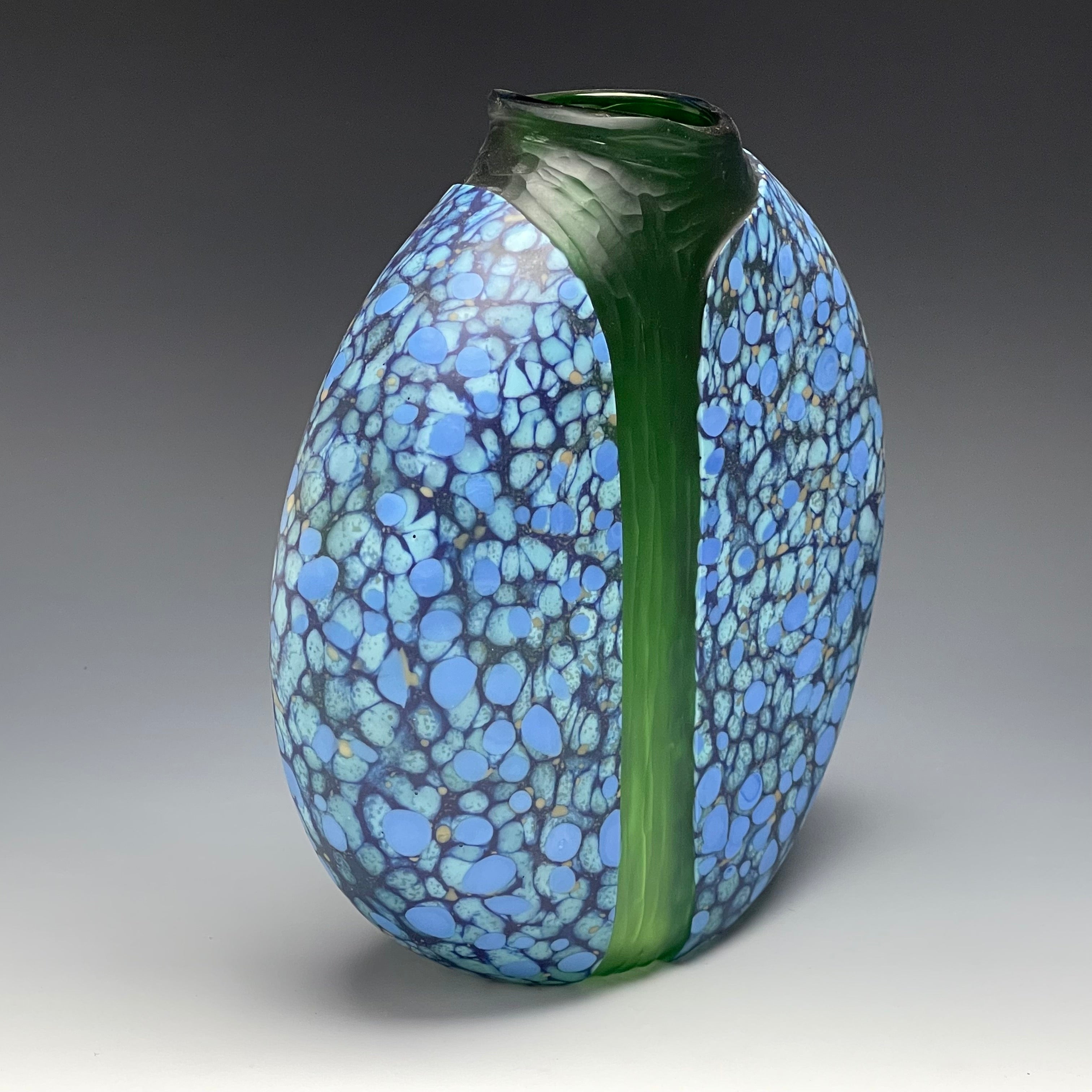 side view of blue blown glass cascade vase