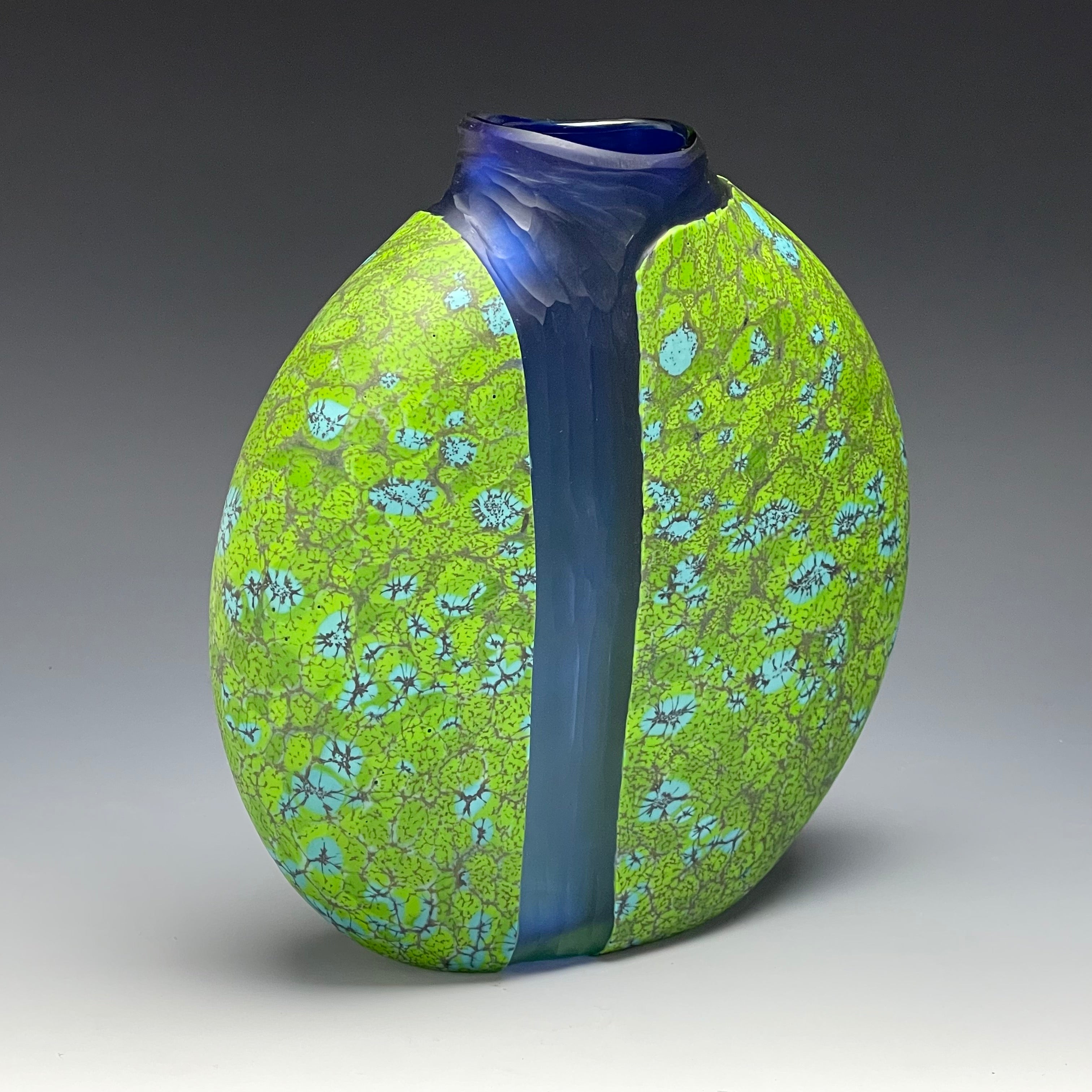 side view of green cascade vase