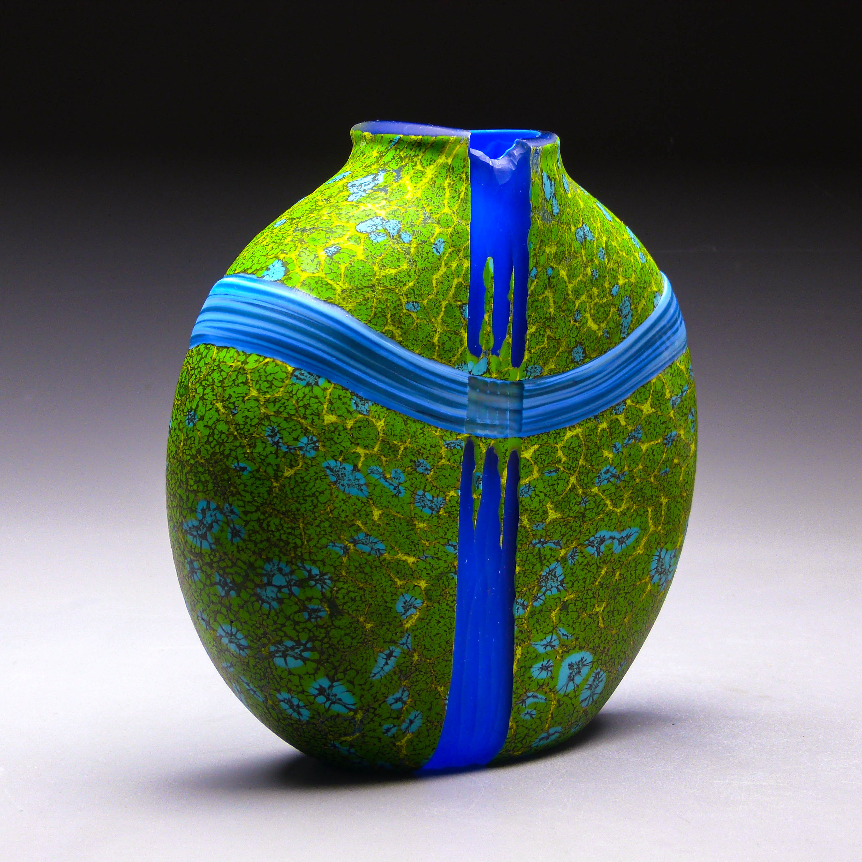 side view of green convergence vase