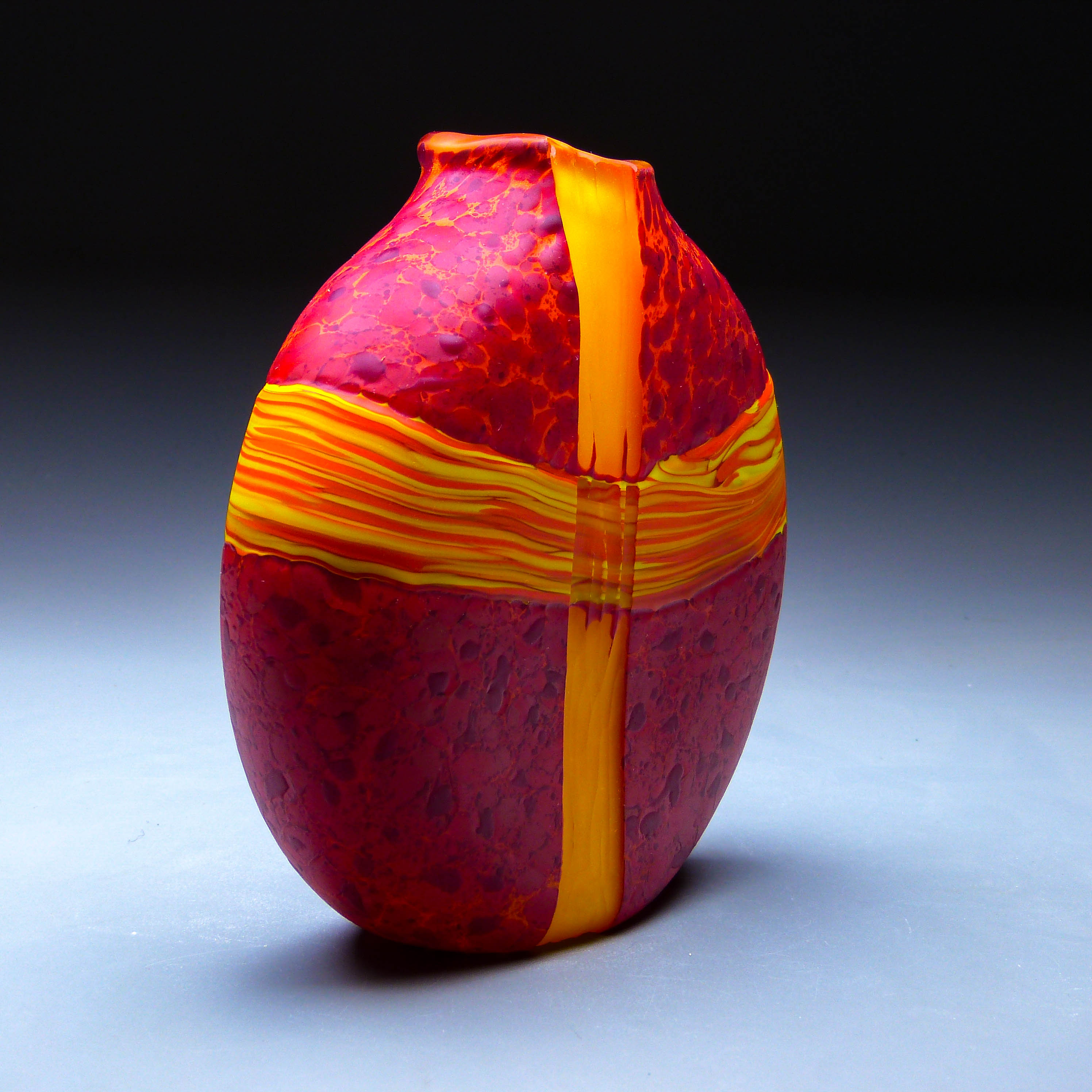 side view of red convergence vase