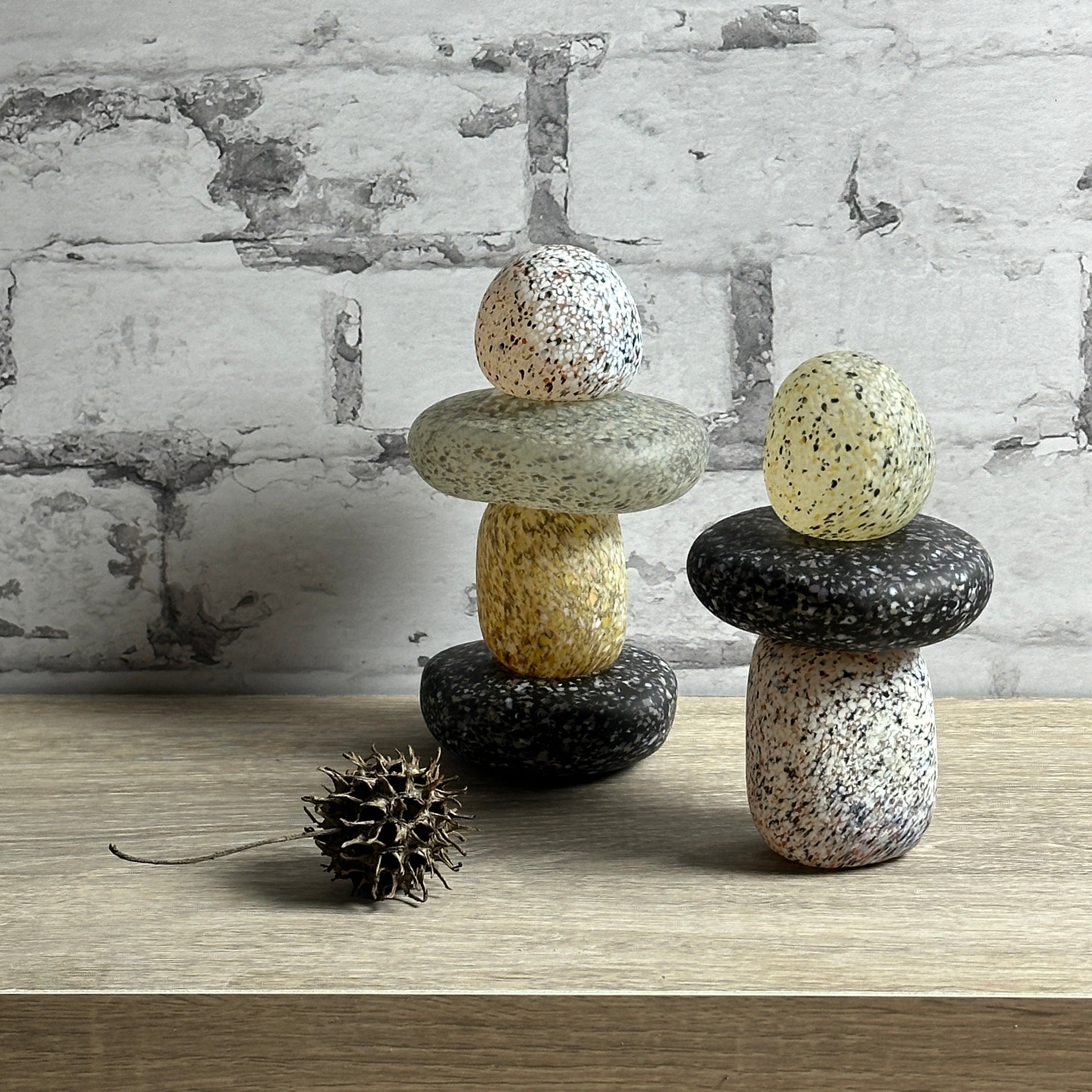 glass cairns on a shelf