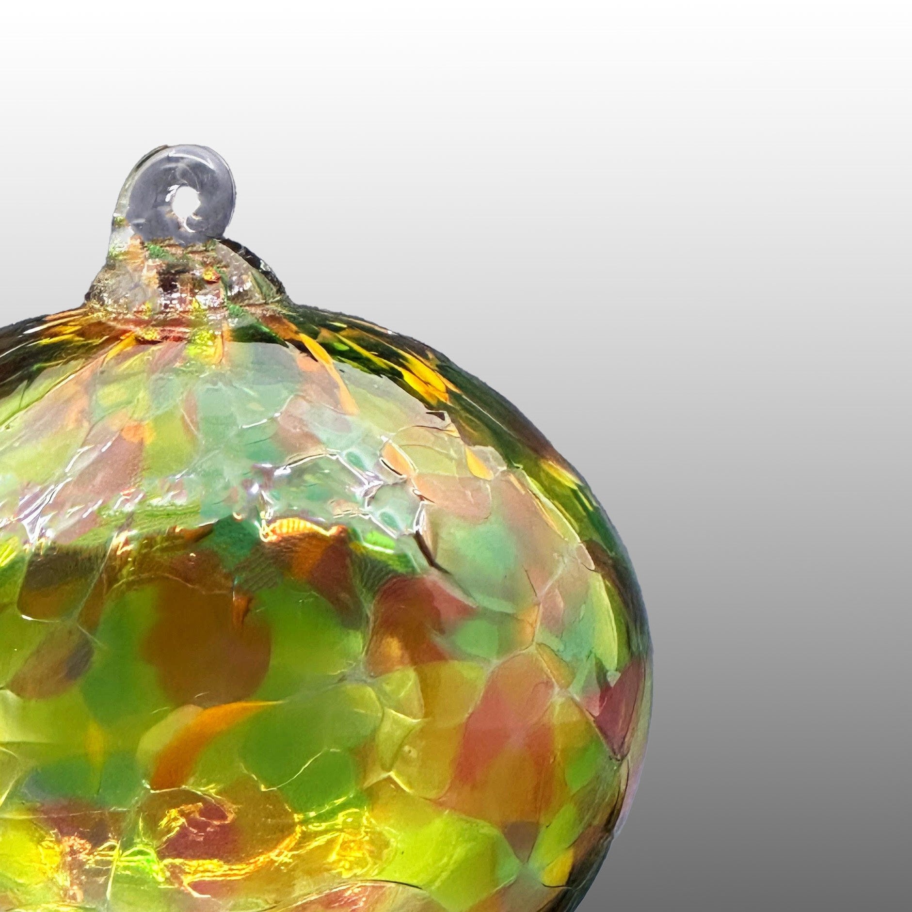 detail of multicolored round hand-blown glass ornament