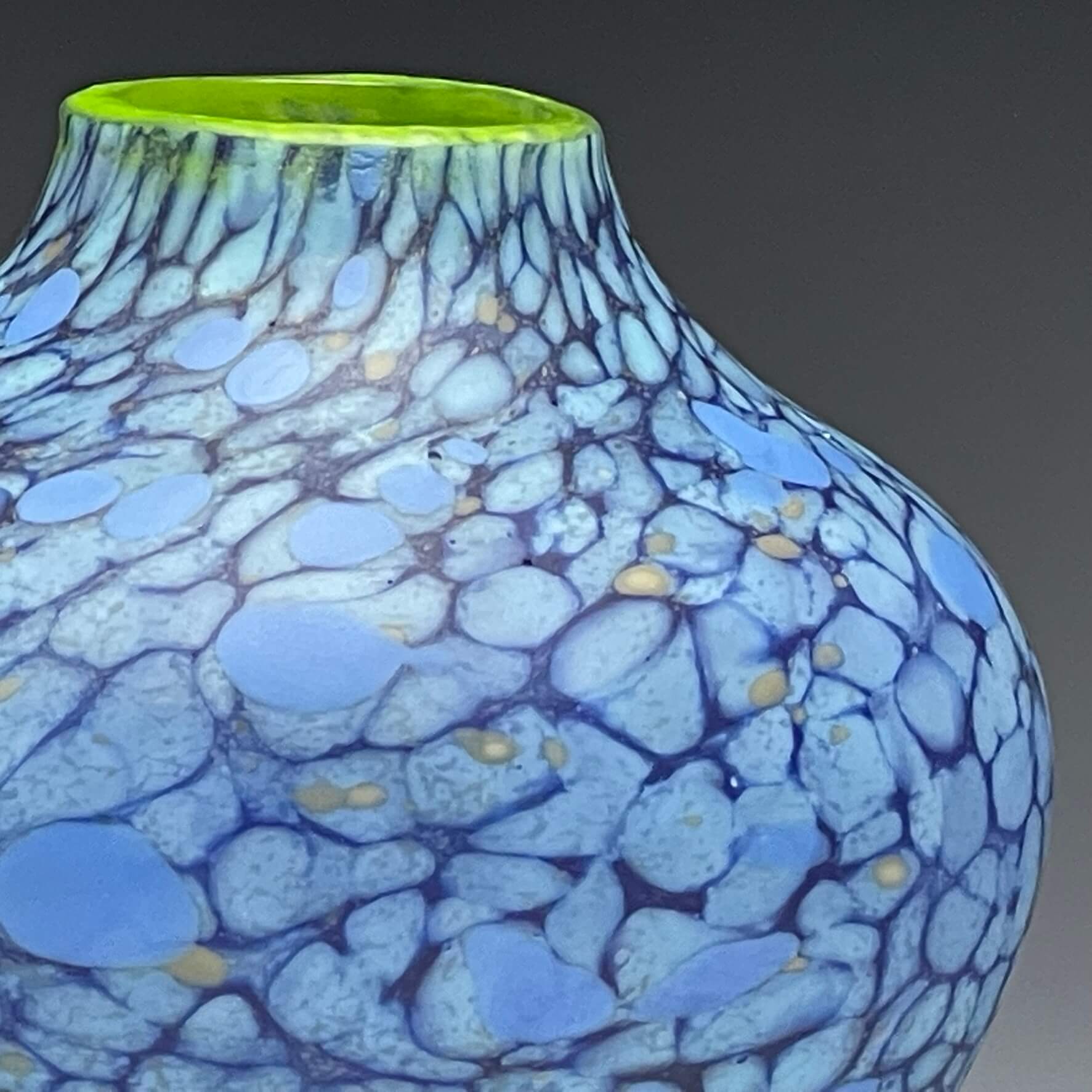 detail of blue hand blown glass vase