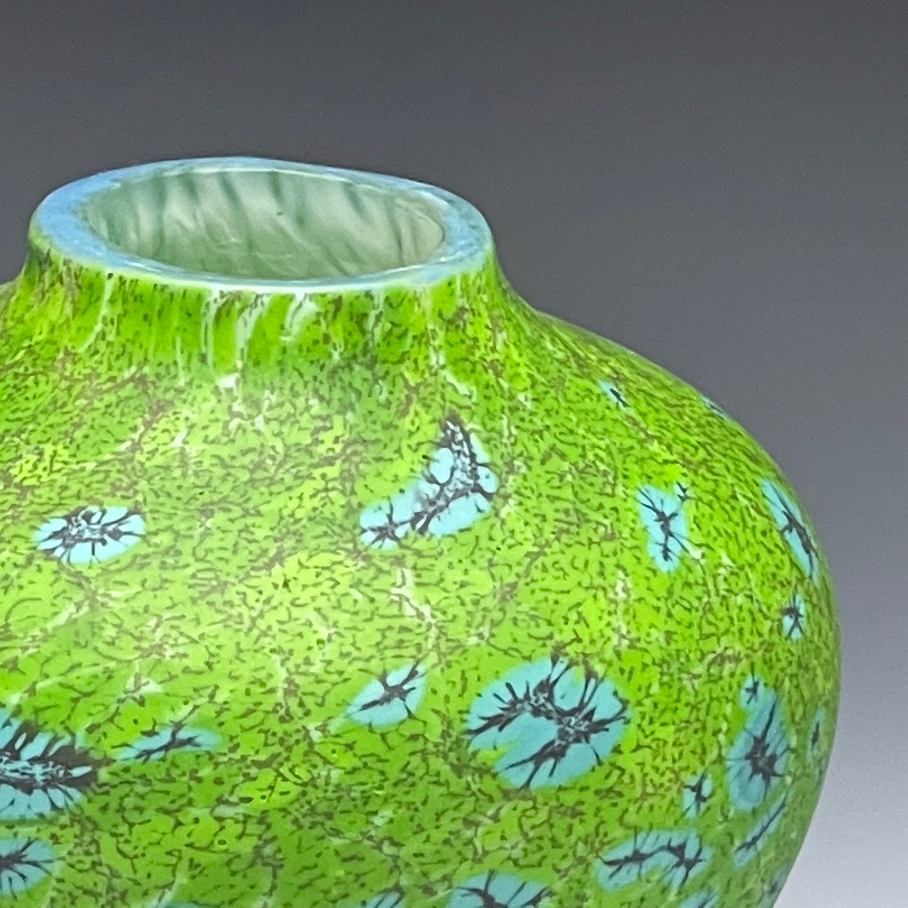 detail of green native vessel, hand-made blown glass vase