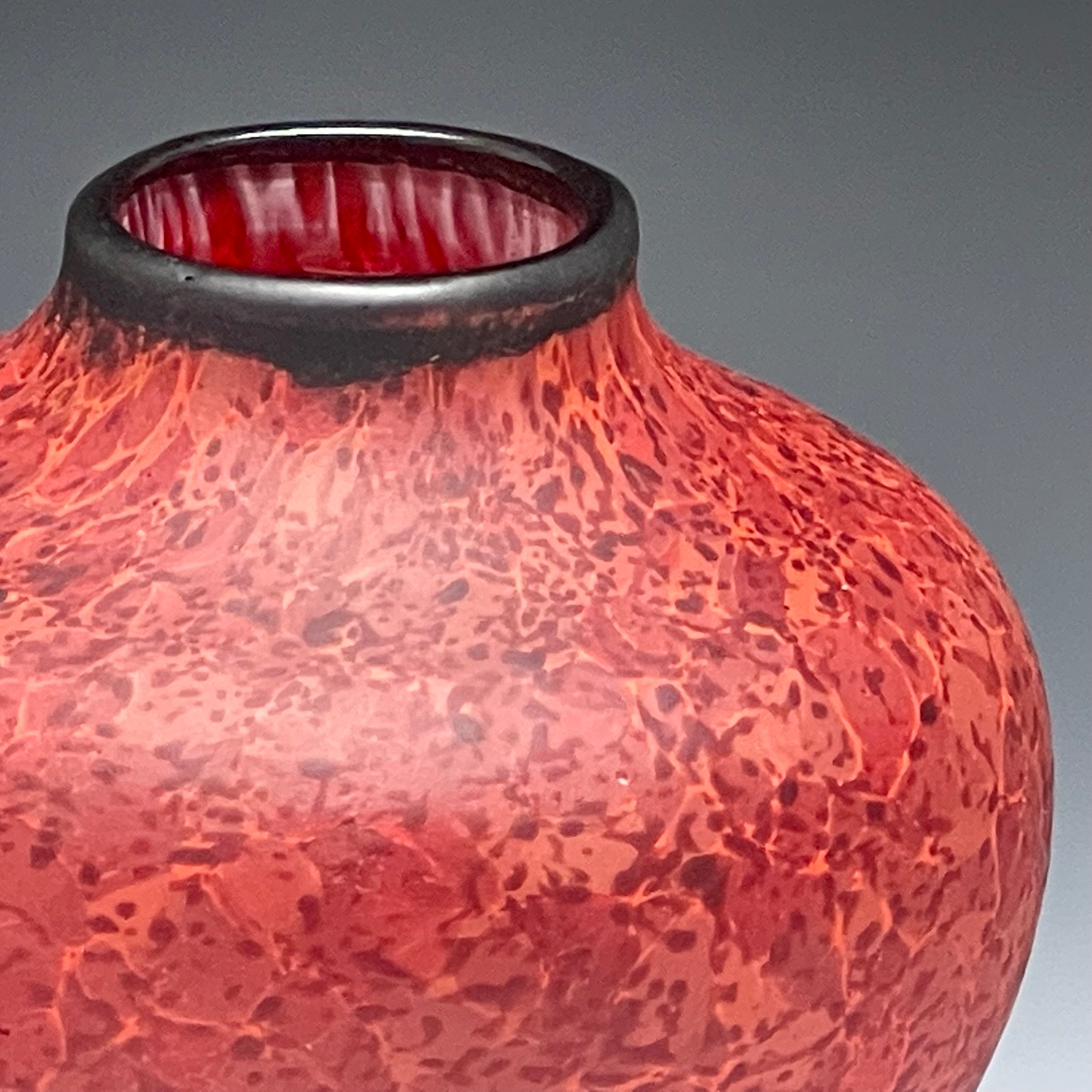 detail of red native vessel, hand-made blown glass vase