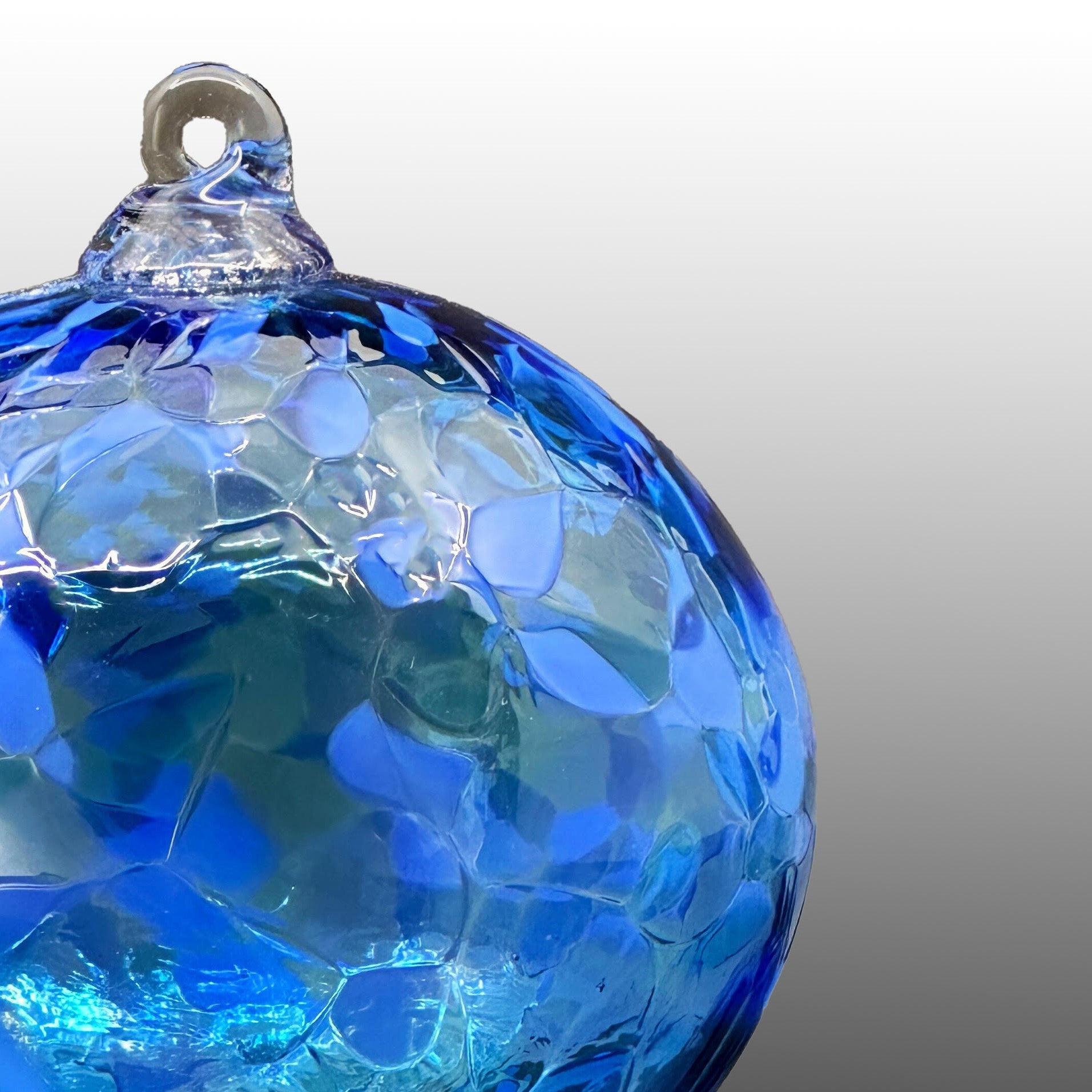 detail of round blue hand-blown glass ornament