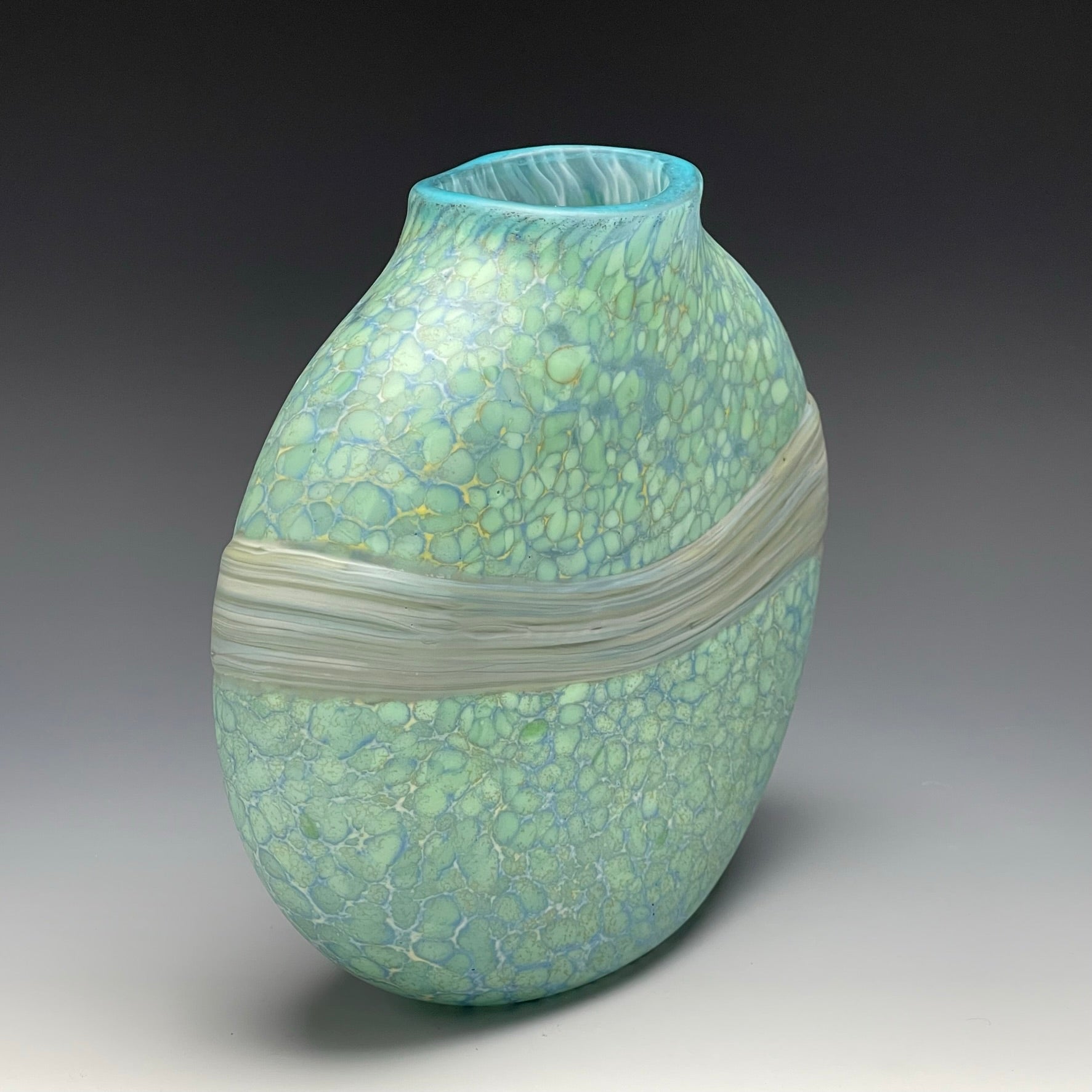 side view of celadon strata vase