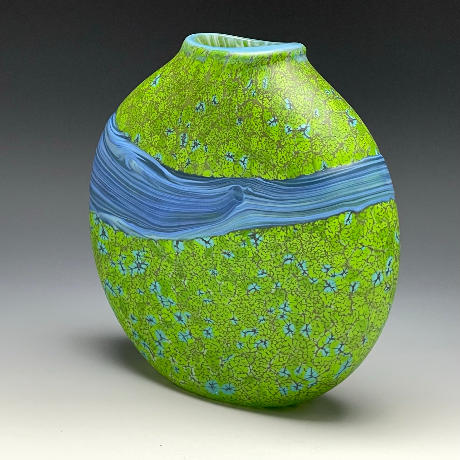 side view of green strata vase